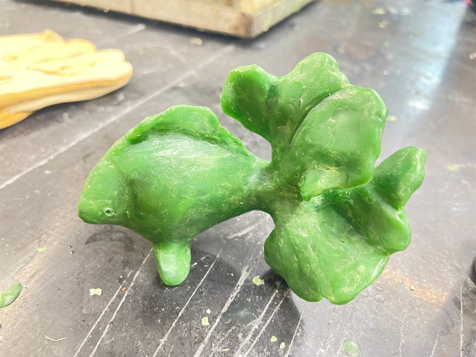 Goldfish — the sculpture modelled by hand in green wax