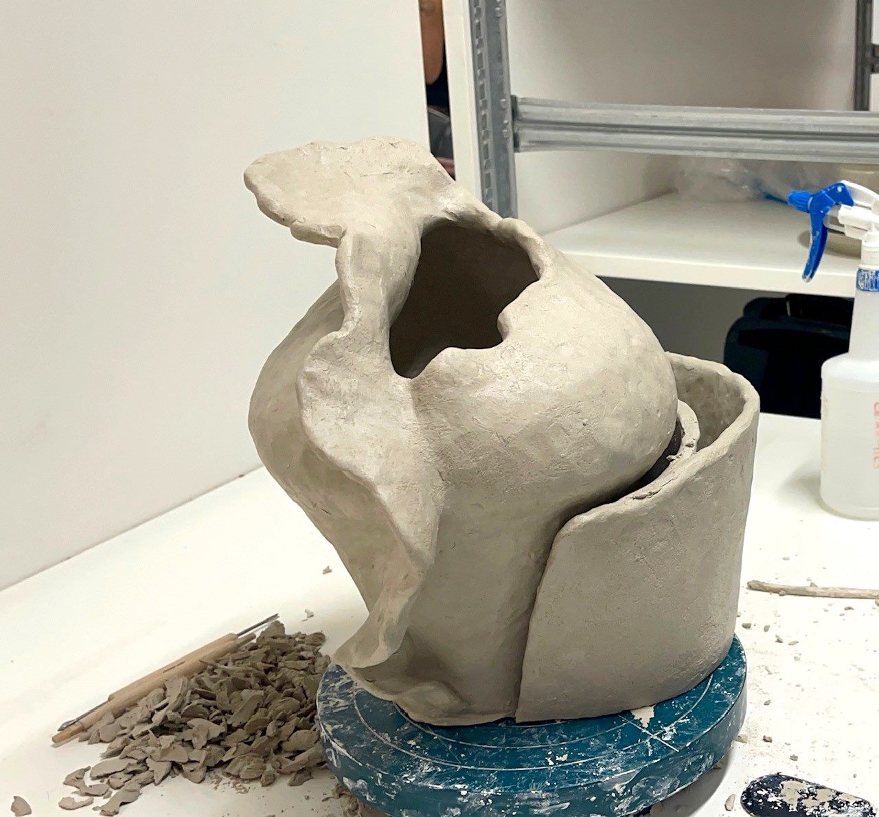 Holding Memory — the vessel being hand-built in raw clay on the studio bench