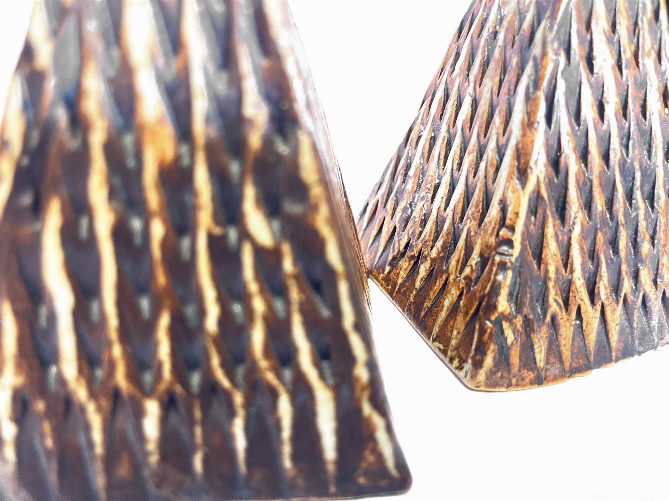 Kilim — close view of the incised chevron carving, iron oxide pooling in the cut lines