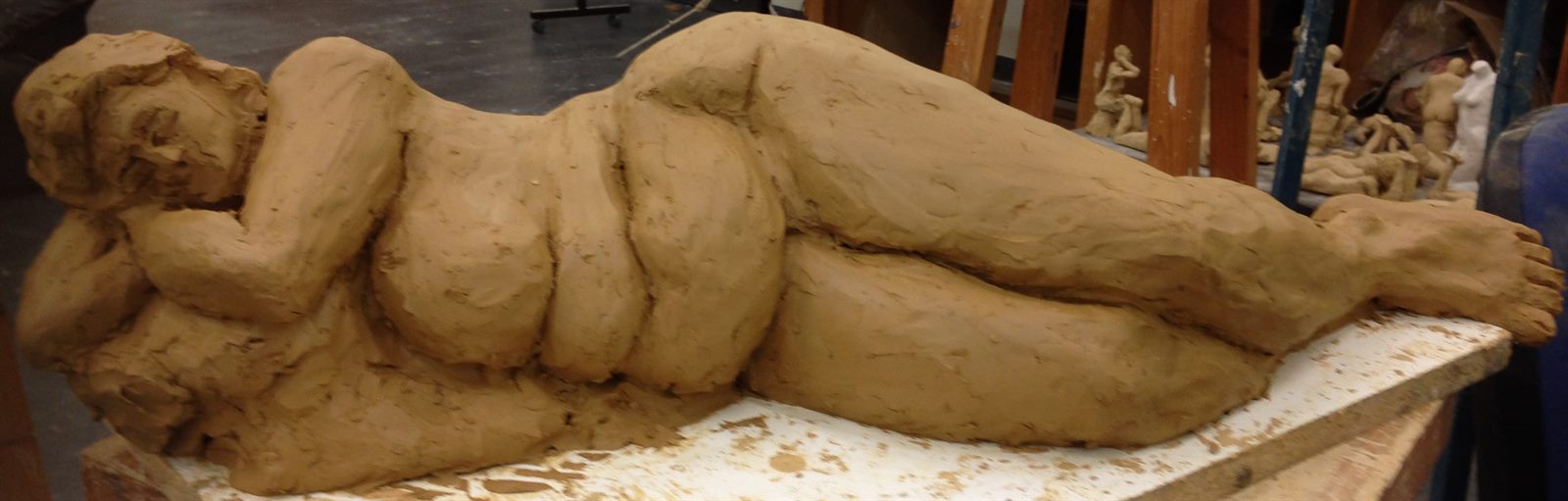 Reclining Figure — a life-size clay figure modelled from a live model