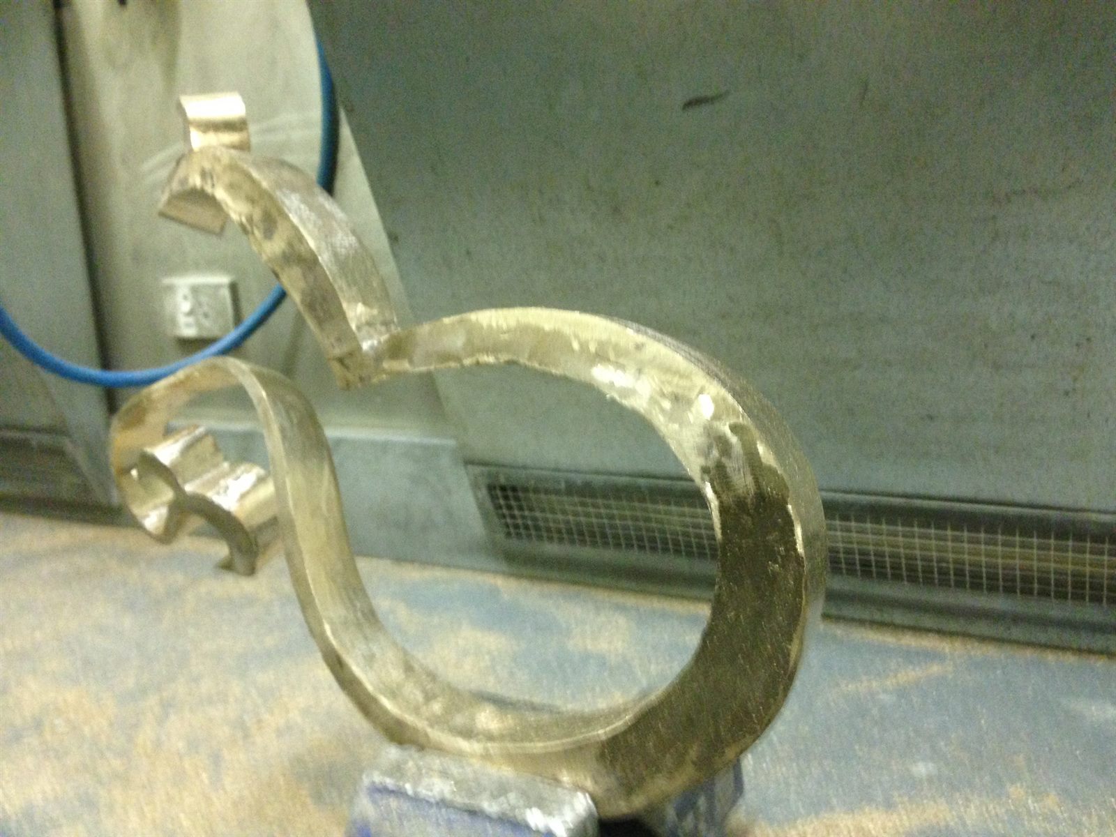 LOVE — cast bronze element during finishing