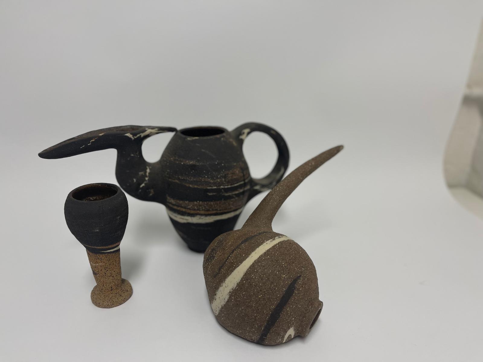 Marlik Vessels — the three forms seen from a lower angle, spouts crossing